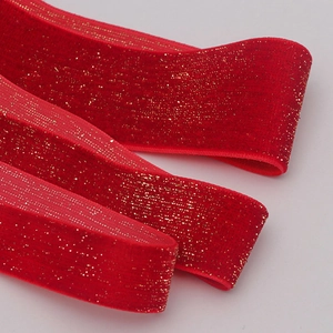 Luxurious red velvet ribbon with gold metallic glitter for Christmas gift wrapping