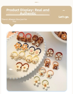 Close-up of cute floral and animal resin accessories on elastic hair bands for children