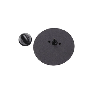 Detail of a round black metal badge back with dual pins and a rubber clutch attachment