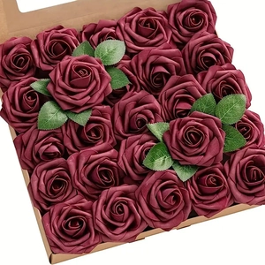 Top view of deep burgundy artificial foam roses with green leaves in a kraft paper box