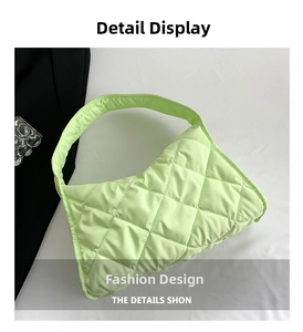 Detailed macro view of the light green quilted nylon tote bag with rhombus pattern texture