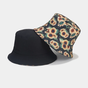 Set of 2 reversible sun hats featuring classic black and vibrant sunflower print designs