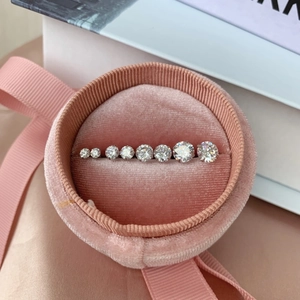 Detailed view of graduated cubic zirconia stones in a pink velvet ribbon gift box