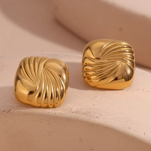 Macro view of square 18K gold plated earrings with unique water ripple texture