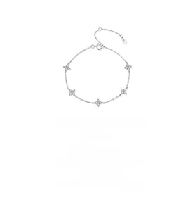 Macro detail of S925 sterling silver four-leaf clover bracelet with zircon pavé accents