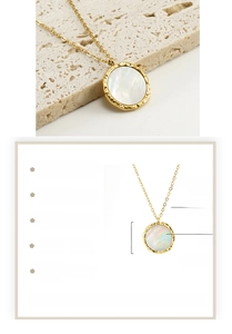 Detail of 18K gold plated stainless steel necklace featuring a 18mm shell pendant charm
