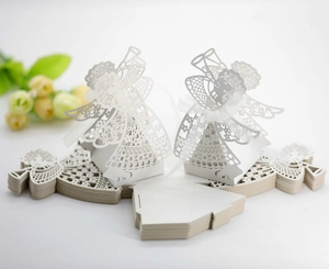 Detailed laser-cut white angel candy gift box with elegant patterns and ribbon tie