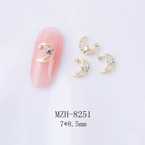 Detail of 7x8.5mm gold crescent moon nail charms with AB rhinestones for nail art