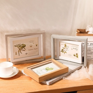 Rotating double-sided wooden 5x7 photo frame with Nordic minimalist style in warm light