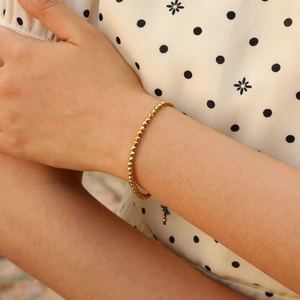 Elegant gold faceted beaded bracelet for women in a minimalist ins-style daily wear look