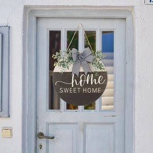 Home Sweet Home wooden door wreath with striped bow and eucalyptus on a blue door
