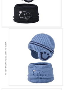 Detail of kids winter knit hat and neck warmer set with cat embroidery and warm fleece lining