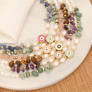 Detailed close-up of Bohemian evil eye necklaces with colorful natural stones and pearls