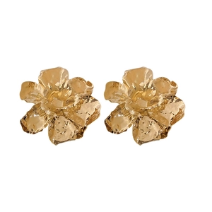 Exaggerated golden metal flower earrings with 3D pleated petals and textured finish