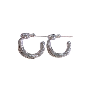 Silver twisted knot C-shaped stud earrings featuring a vintage minimalist metallic design