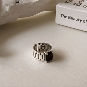 Macro detail of S925 silver watchband ring featuring a square black zircon stone
