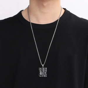 Plague doctor crow mask pendant necklace in silver stainless steel on model neck