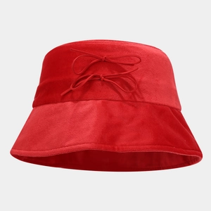 Red velvet bucket hat with delicate bow accents for an elegant autumn outdoor look