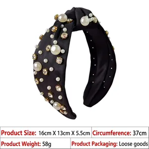 Detail of black knotted headband with white pearls and rhinestones 16x13x5.5cm