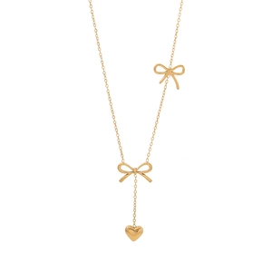 Elegant gold bow necklace with a heart pendant and delicate chain on a white background