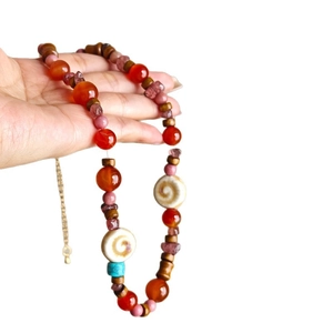 Bohemian irregular beaded necklace with red agate, wood beads and white spiral discs