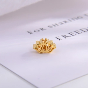 Macro detail of golden hollow lotus spacer bead made of S925 sterling silver for jewelry DIY