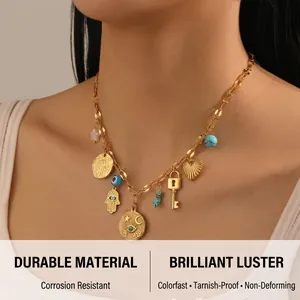 Detail of vintage gold necklace with evil eye charm, star coin, and turquoise beads