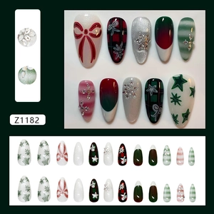 Christmas press-on nails with red bows, snowflakes, and festive green plaid patterns