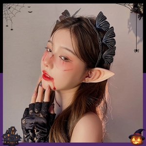 Halloween butterfly headband with elf ears and lace gloves on model with spooky background
