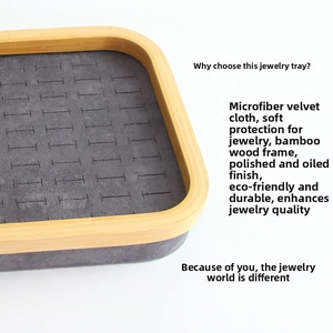 Detailed texture of bamboo frame and grey microfiber slots on a ring display tray