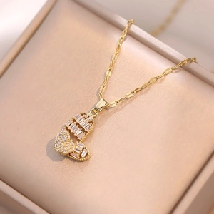 Rotating double heart pendant necklace with shimmering crystals in a beige gift box