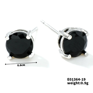 Close-up of black crystal stud earrings with 6mm diameter and silver four-prong setting