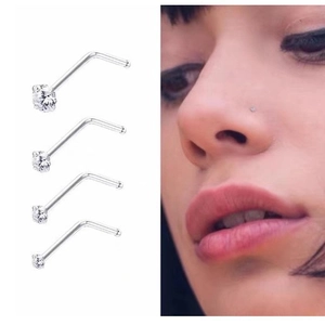 Set of four G23 titanium nose studs with clear zircon stones including a model wearing view
