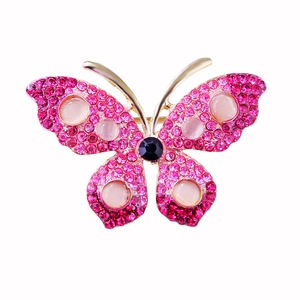 Sparkling pink rhinestone butterfly brooch with opal accents on a gold finish metal base