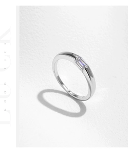 Close-up of s925 sterling silver ring featuring a baguette cut sparkling zircon stone