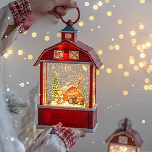 Red barn style Christmas snow lantern with snowman scenery and warm LED lighting