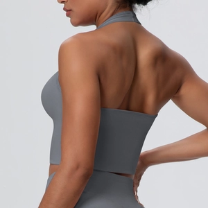 Macro detail of the racerback design and breathable knit fabric on this grey sports bra