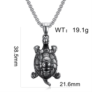 Detailed macro view of turtle pendant with box chain and dimensions 38.5mm x 21.6mm