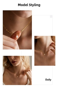 Detailed macro view of 18K gold-plated stainless steel chain with a white pearl pendant