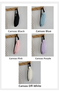 Detailed view of canvas waist bags in black, blue, pink, purple, and cream colors