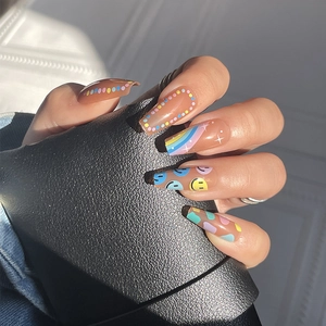 Rainbow polka dot and smiley face long coffin press-on nails with colorful star patterns
