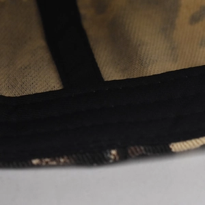 Macro shot of cotton leopard print baseball cap interior stitching and black webbing