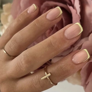 French style white minimalist square press-on nails on hands with a gold T-shaped ring