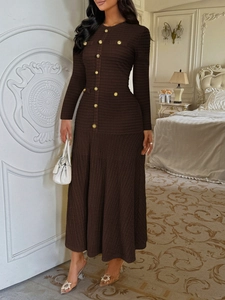 Detail of elegant dark brown long-sleeved dress with golden buttons and knit texture