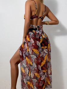 Rear view of tropical leaf print bikini with matching side split sheer mesh sarong skirt
