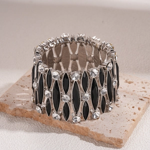 Bracciale elastico argento con pietre nere a rombo e strass su base di marmo