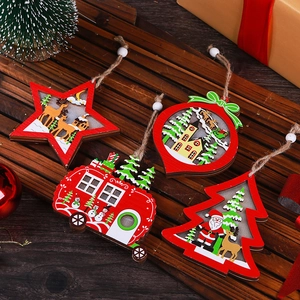 Set of four hollow wooden Christmas ornaments featuring star, bus, and tree shapes