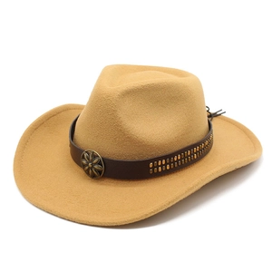 Close-up of tan cowboy hat with brown leather band and antique gold floral buckle