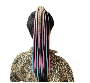 Detail of colorful braided hair extensions for girls with pink blue and yellow synthetic braids