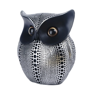 Modern resin owl sculpture in black and silver with hollow dot pattern home decor